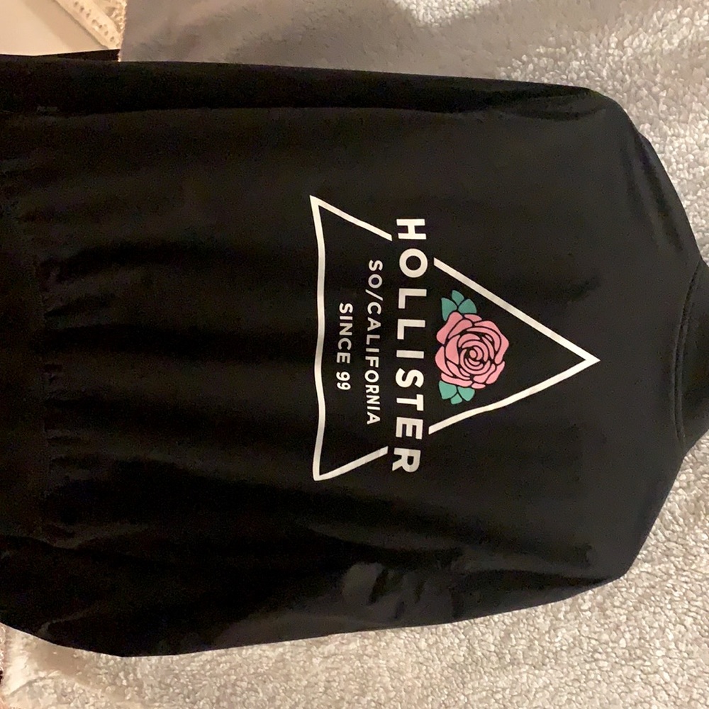 A black unisex jacket from Hollister